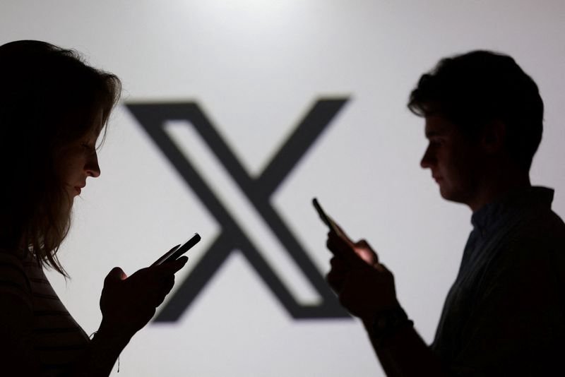 X logo displayed on a smartphone screen