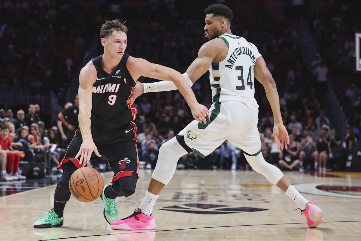 Jimmy Butler e Bam Adebayo comemoram uma vitória