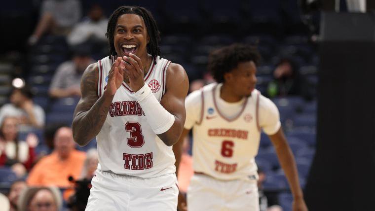 Alabama Crimson Tide basketball players celebrating on the court during March Madness