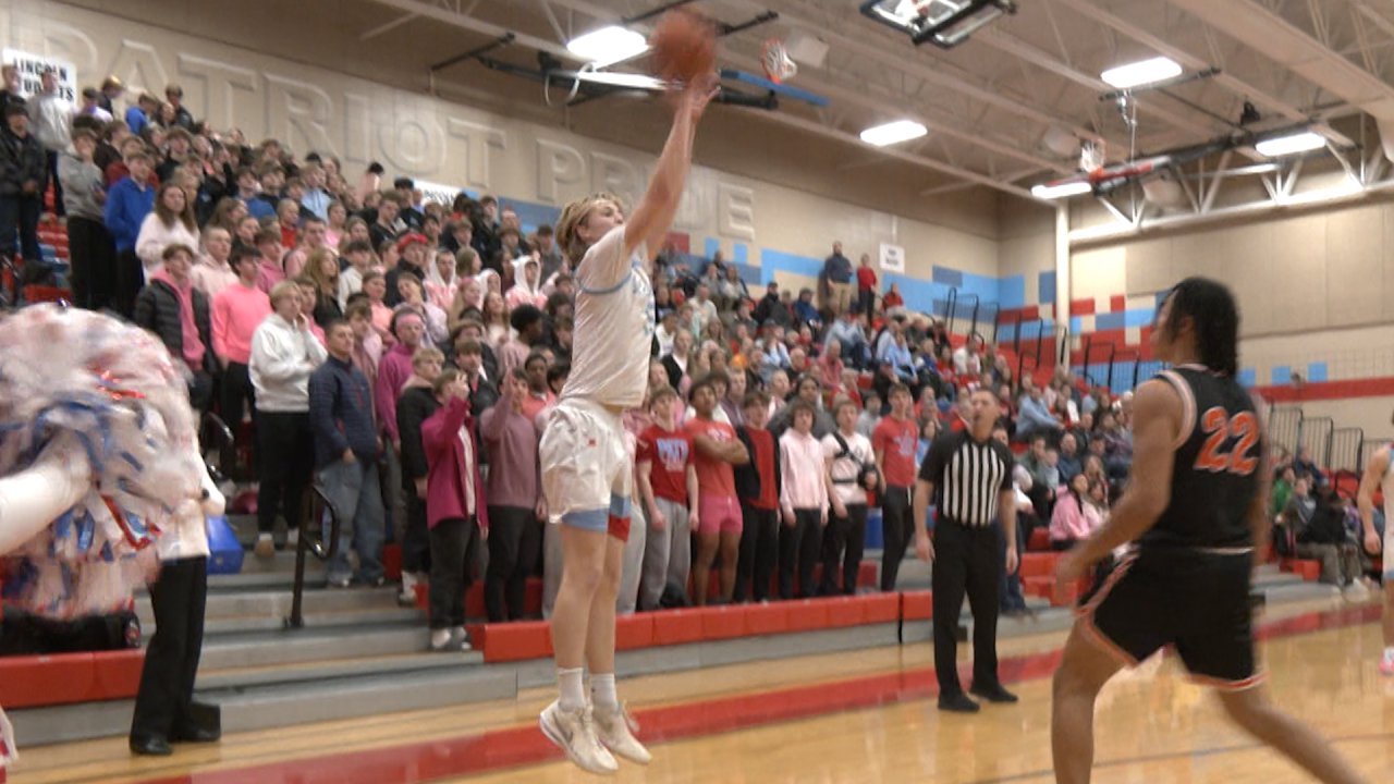Young American basketball players giving their all during a high school championship game