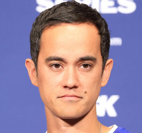 Miguel Rojas smiling in his Dodgers uniform