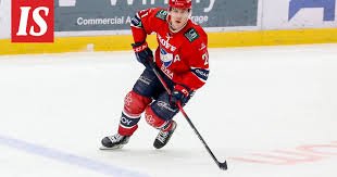 A packed hockey arena buzzing with atmosphere