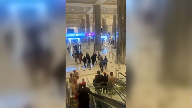 A thick plume of smoke rises over the Dubai skyline after a missile interception