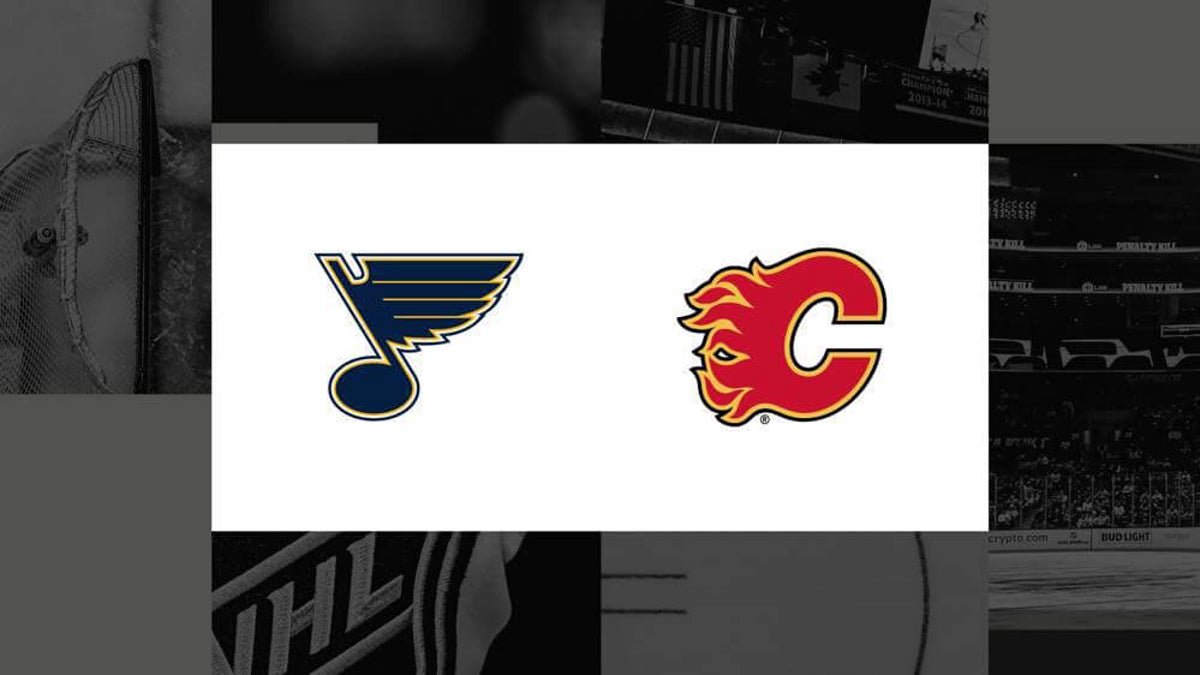 Blues and Flames battle along the boards during a heated game at the Saddledome