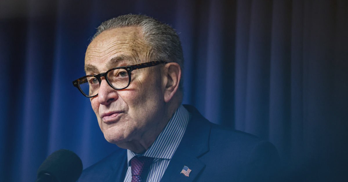 Senate Majority Leader Chuck Schumer speaking at a podium