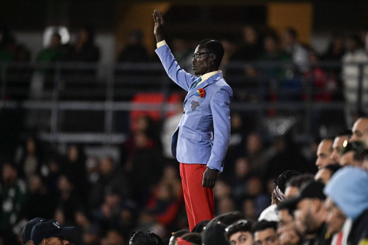 DR Congo fans celebrate with a symbolic statue during the World Cup qualifier