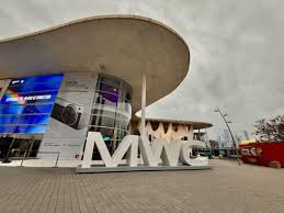 Panoramic view of MWC 2026 in Barcelona with attendees trying out new devices