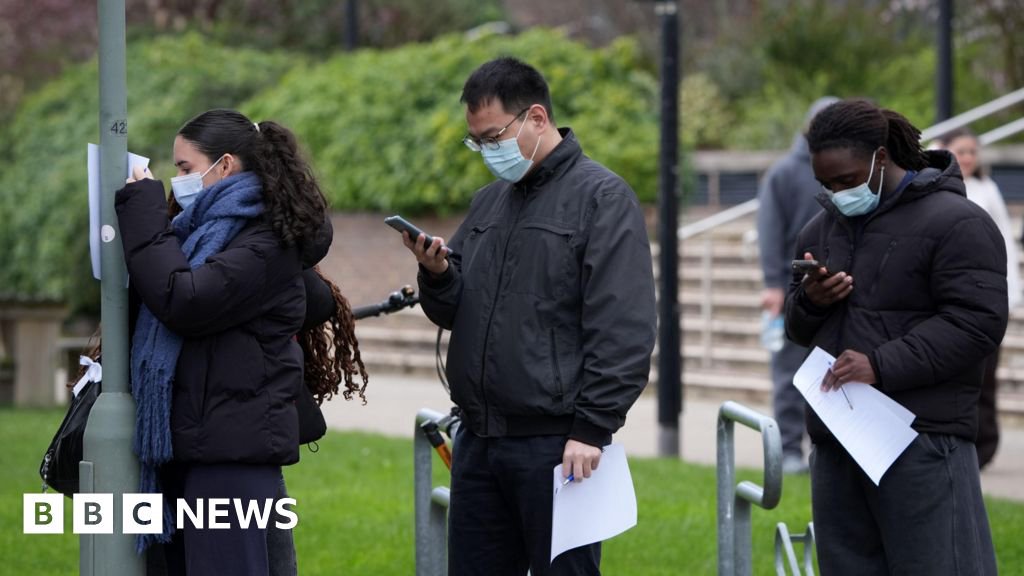 Students queueing for antibiotics at a university in Kent