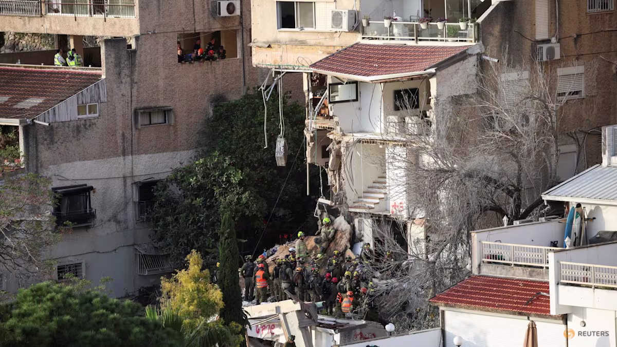 Smoke and debris after missile strike in Haifa