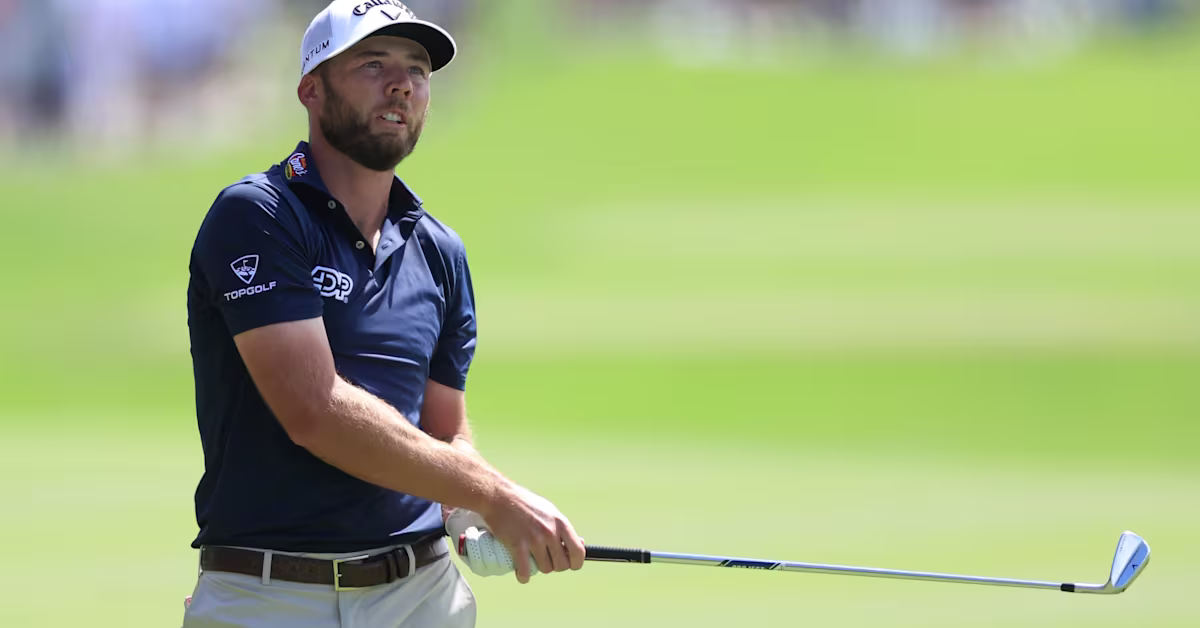 Sam Burns lining up a putt during a practice round at the Masters