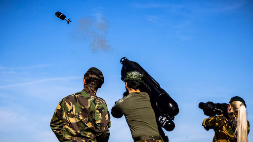 Rescue workers pull a baby from the rubble after a Russian drone strike